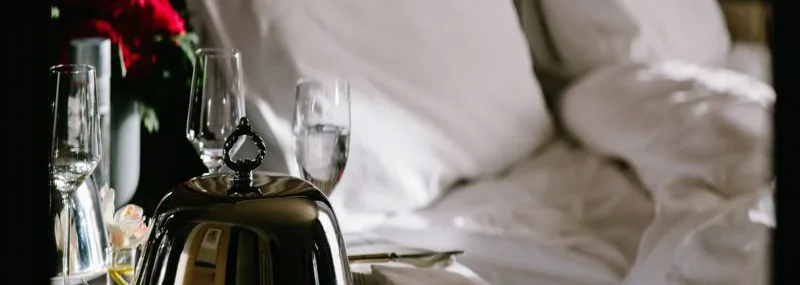 Photograph of our room service cart presentation as they sit next to you unmade bed in the morning.