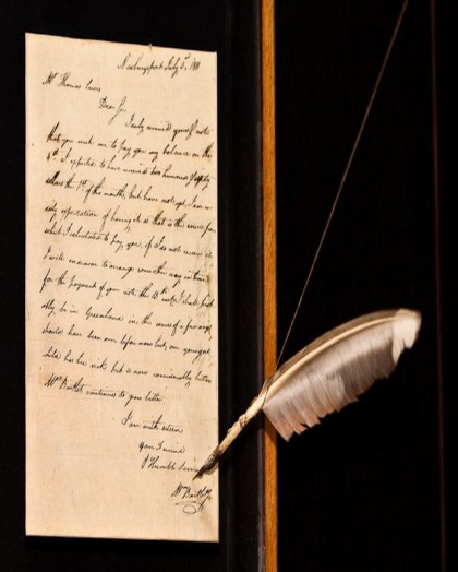 Historic piece of art that is showcased in a letter format with a feather pen