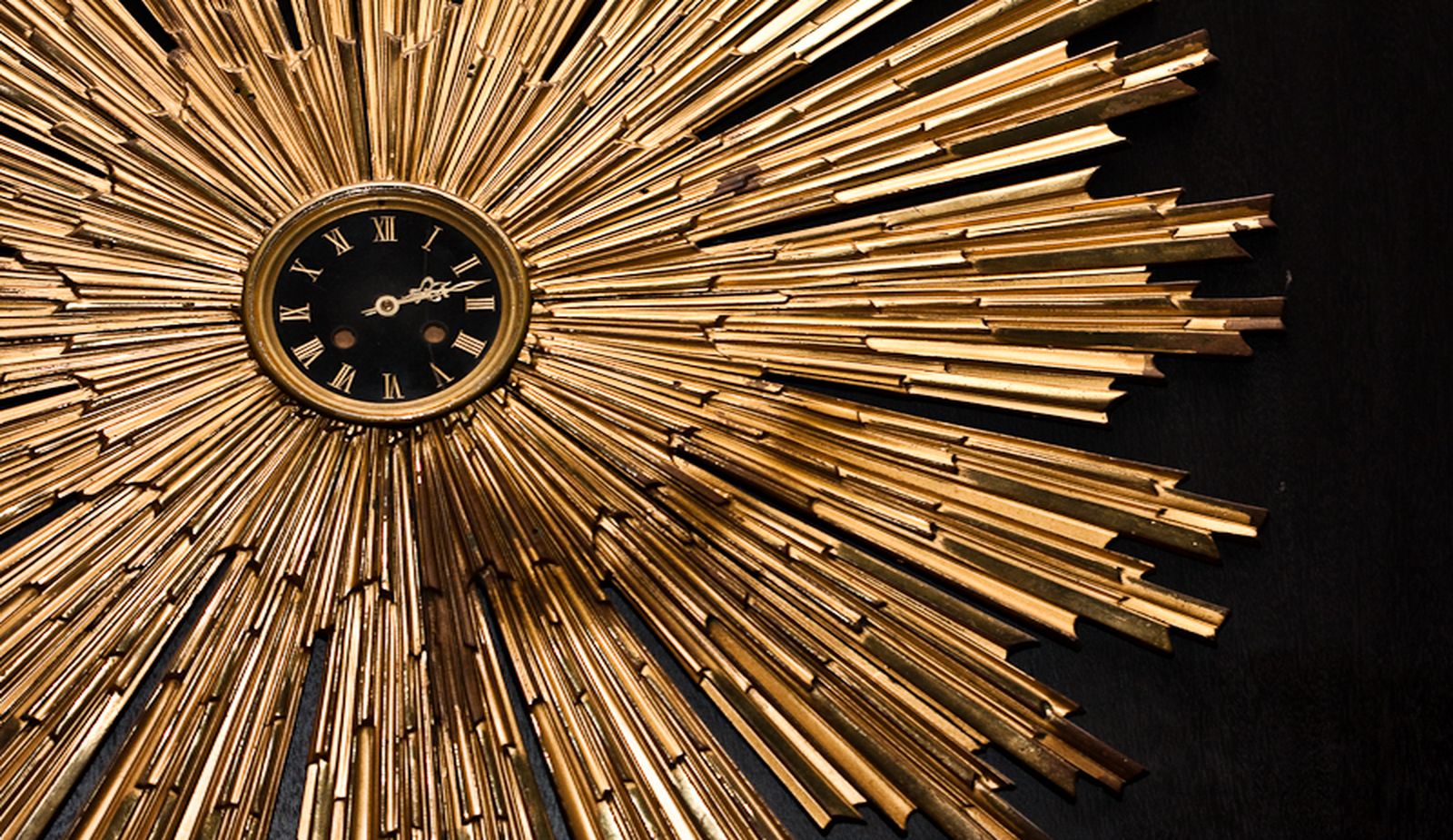 round gold clock that is featured in our hotel lobby.