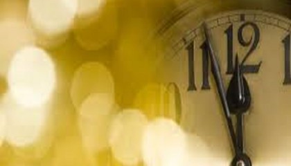 old black and white clock that reads midnight for New Years Eve