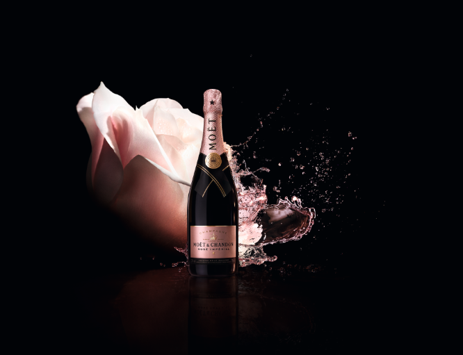 Bottle of Rose Moet Chandan with a pink rose in the background