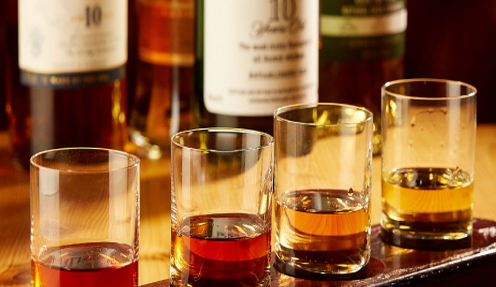 tasting glasses of 4 different kinds of bourbon in our restaurant.