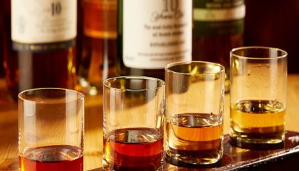 tasting glasses of 4 different kinds of bourbon in our restaurant.