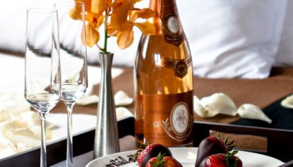 champagne and chocolate covered strawberries sample amenity that can be ordered through room service.