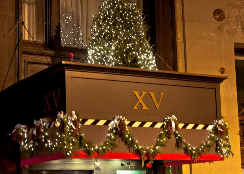 holiday decorations to the exterior of the XV Beacon hotel during christmas
