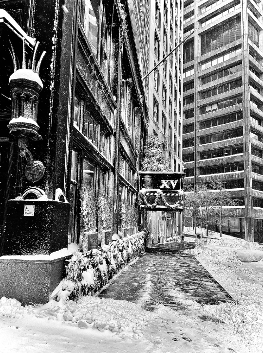 Black and white picture of the exterior of XV Beacon Hotel after a snow fall