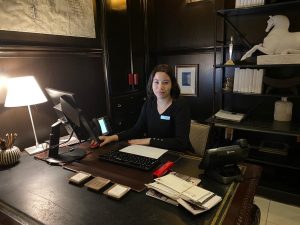 photo of our concierge team member sitting at the concierge desk