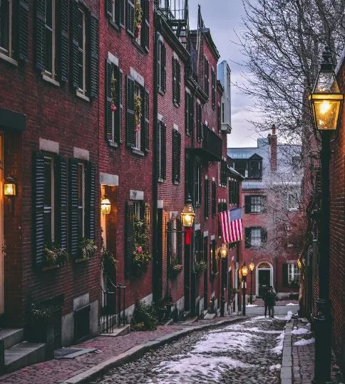 snow covered cobblestone street in Beacon Hill, MA