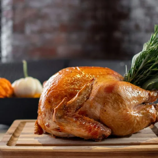 Thanksgiving Turkey with a pumpkin display in the background